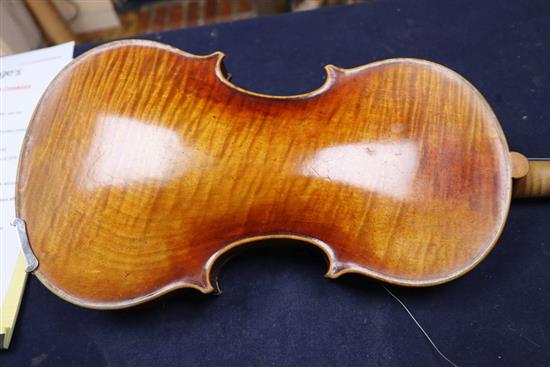 An early 20th century violin, bears label Paolo Fiorini, Taurini 1928, cased with a bow, single-piece back 36cm